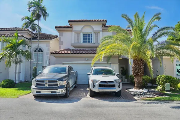 a car parked in front of a house