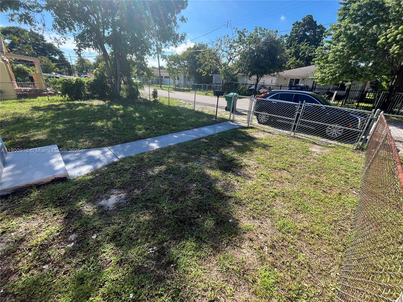 1923 Northwest 66th Street Miami, FL 33147 - Photo 2 of 27 a view of a backyard with sitting area