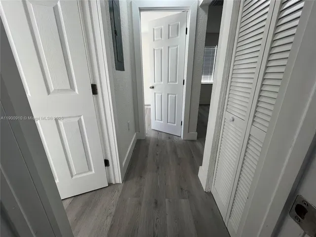 a view of a bathroom from a hallway