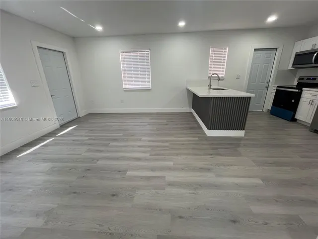 a view of kitchen and windows