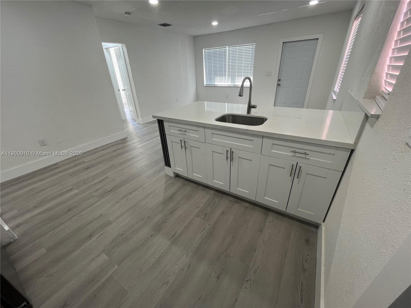 1923 Northwest 66th Street Miami, FL 33147 - Photo 9 of 27 a bathroom with a sink and a mirror