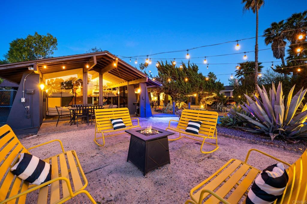 754 El Rancho Drive El Cajon, CA 92019 - Photo 43 of 55 a backyard of a house with barbeque oven table and chairs