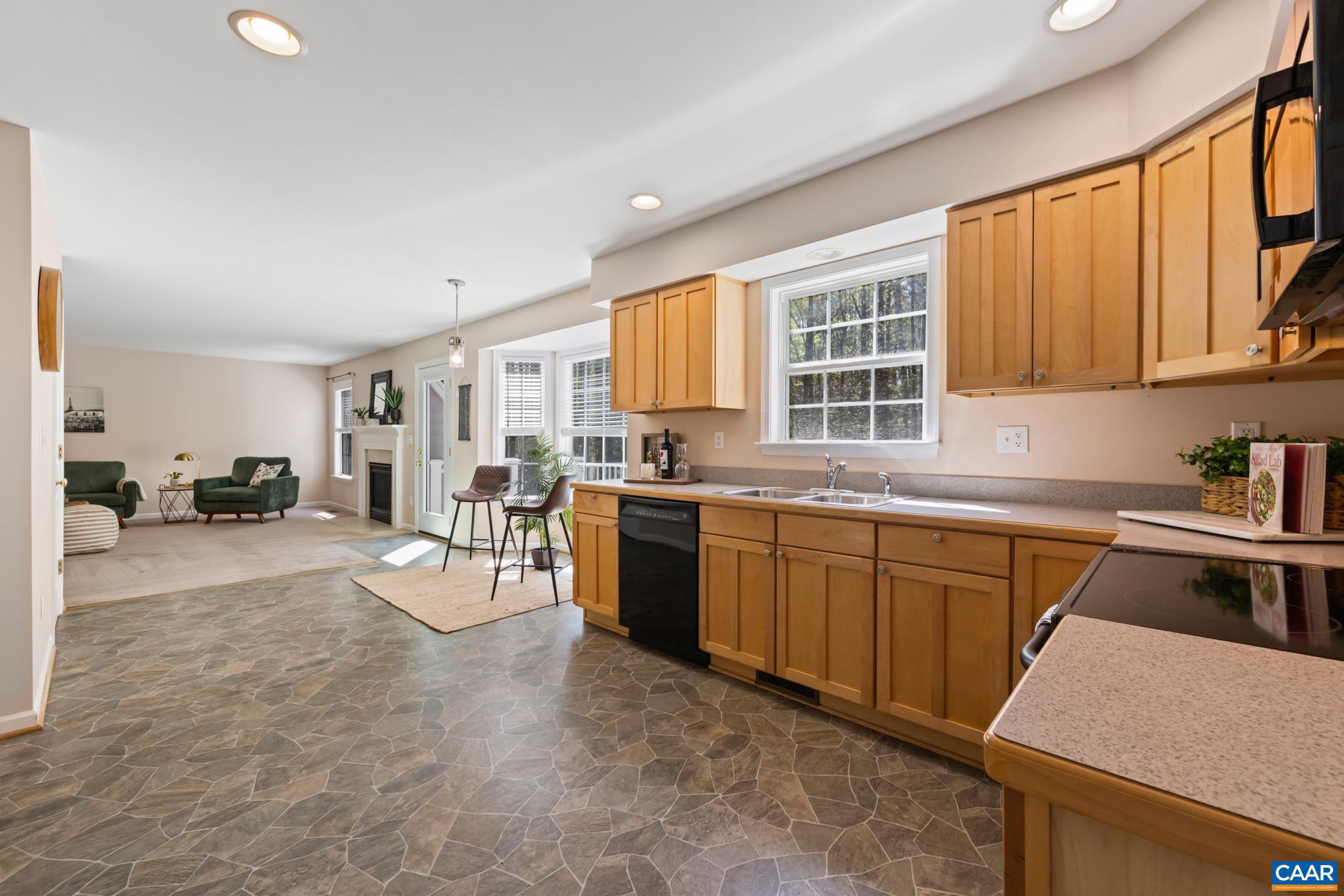 96 Red Cedar Road Barboursville, VA 22923 - Photo 18 of 59 a kitchen with a sink stove and cabinets
