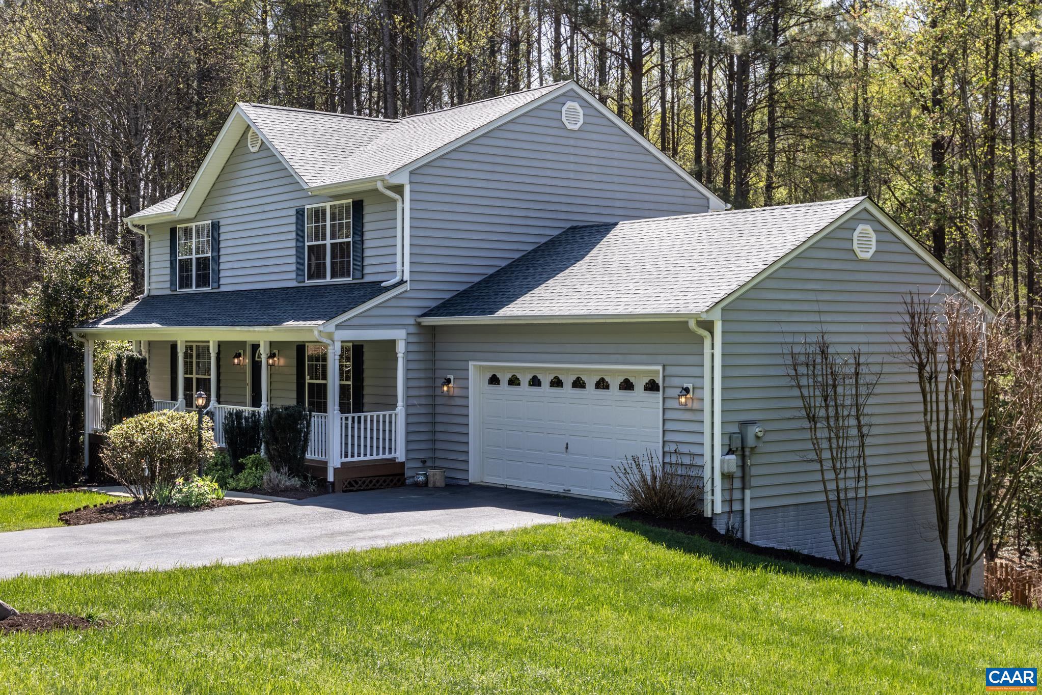 96 Red Cedar Road Barboursville, VA 22923 - Photo 2 of 59 a front view of a house with a garden