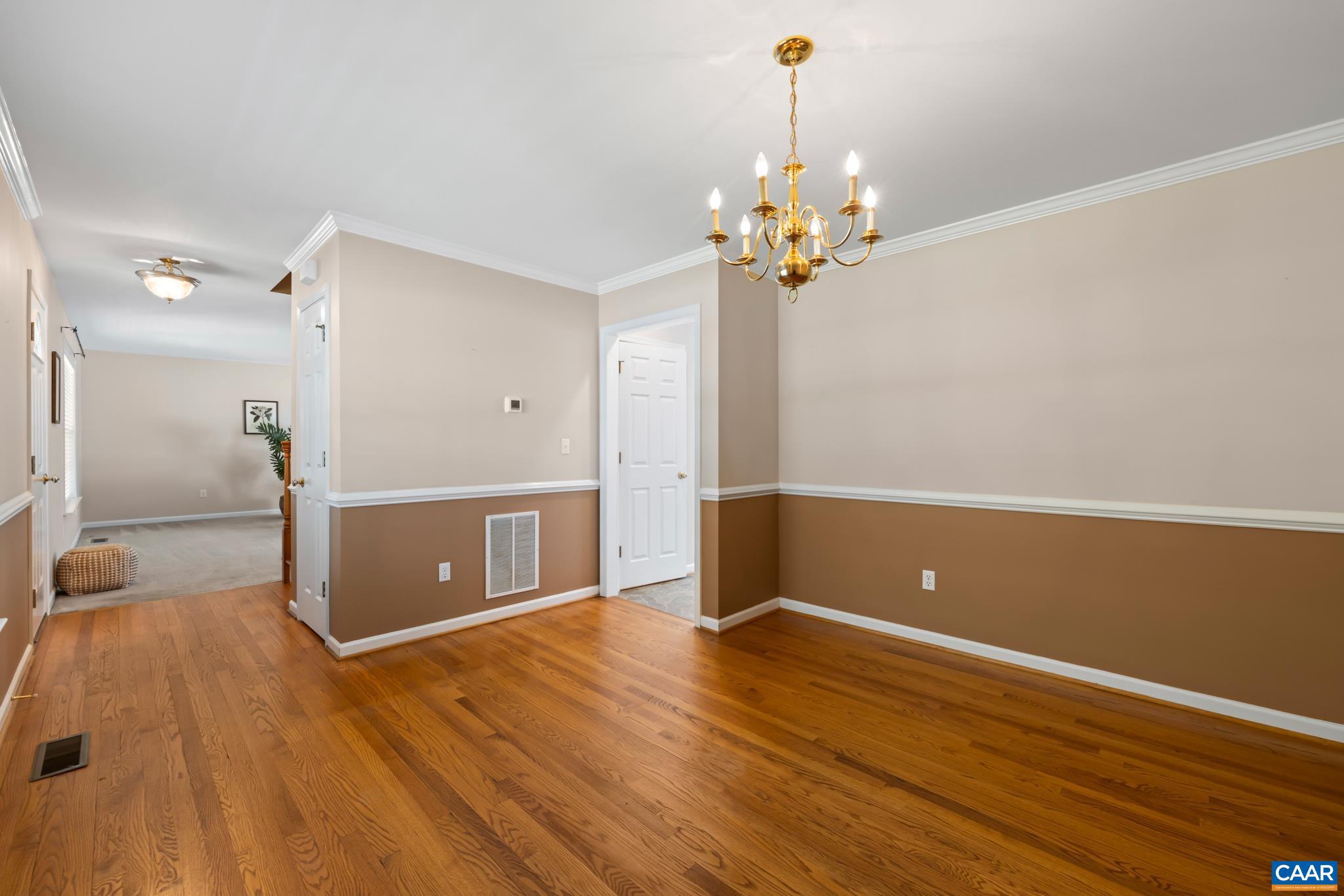 96 Red Cedar Road Barboursville, VA 22923 - Photo 22 of 59 a view of a livingroom with a furniture wooden floor and a chandelier