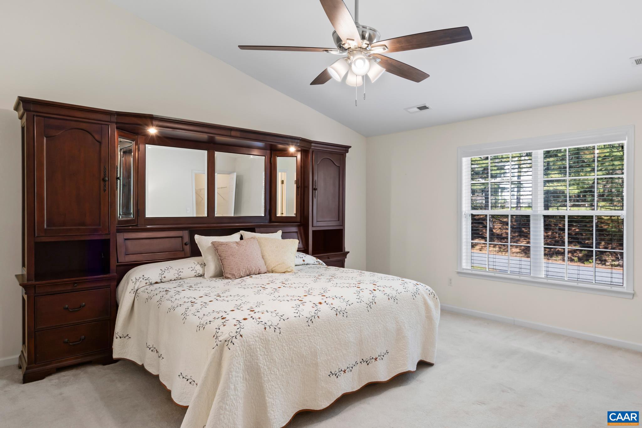 96 Red Cedar Road Barboursville, VA 22923 - Photo 26 of 59 a bedroom with a large bed and a large window