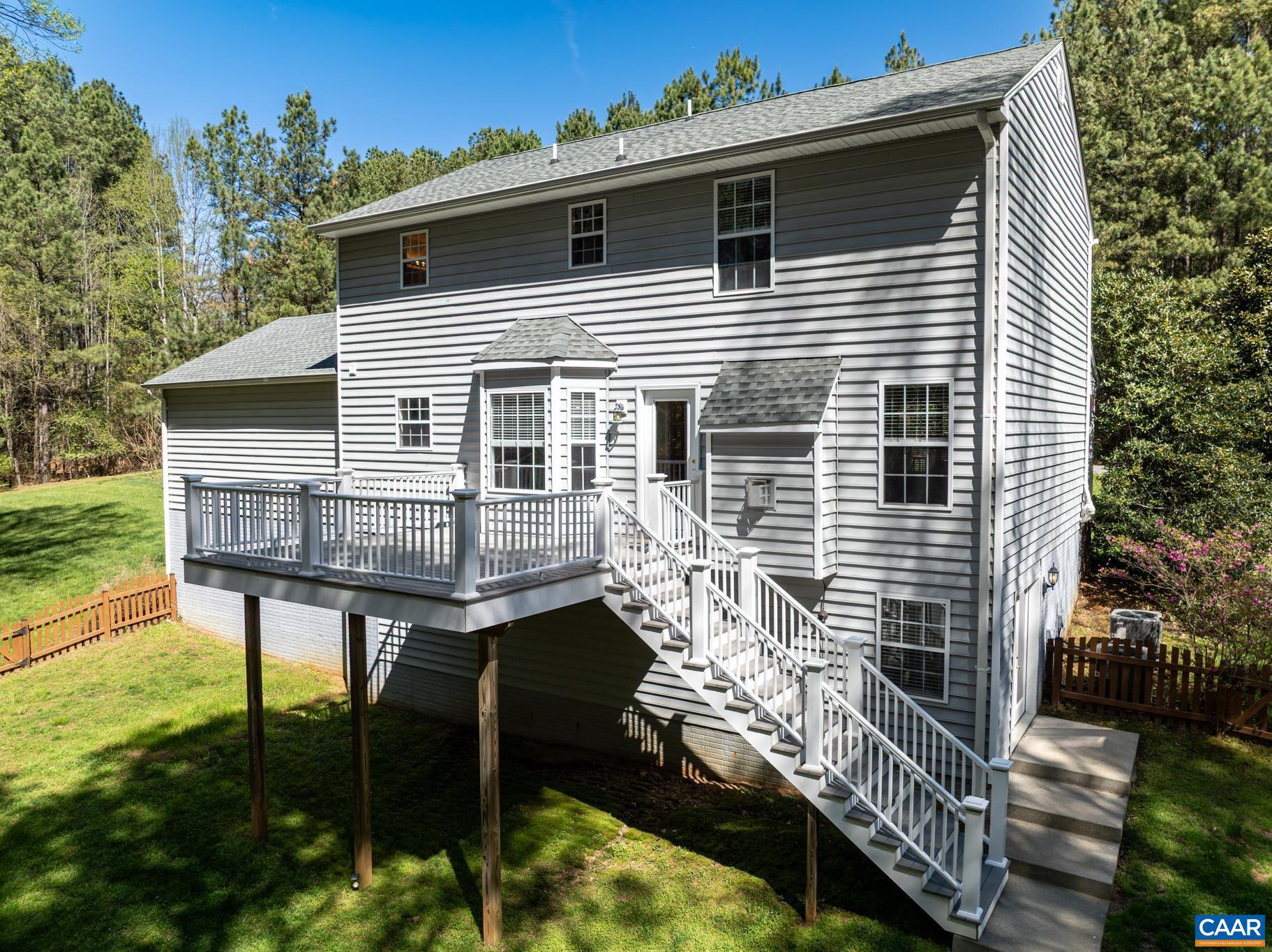 96 Red Cedar Road Barboursville, VA 22923 - Photo 3 of 59 a balcony with table and chairs