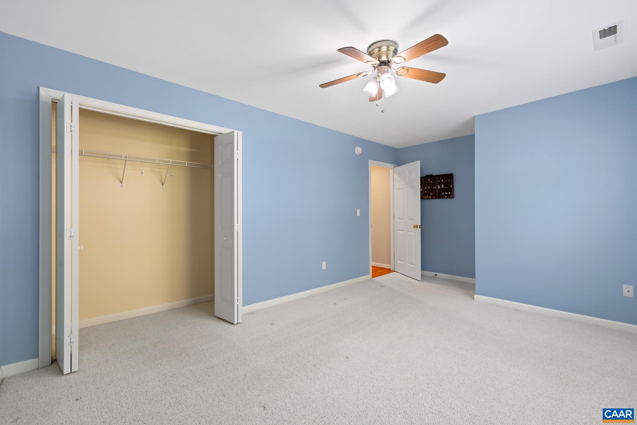 96 Red Cedar Road Barboursville, VA 22923 - Photo 37 of 59 an empty room with closet and fan
