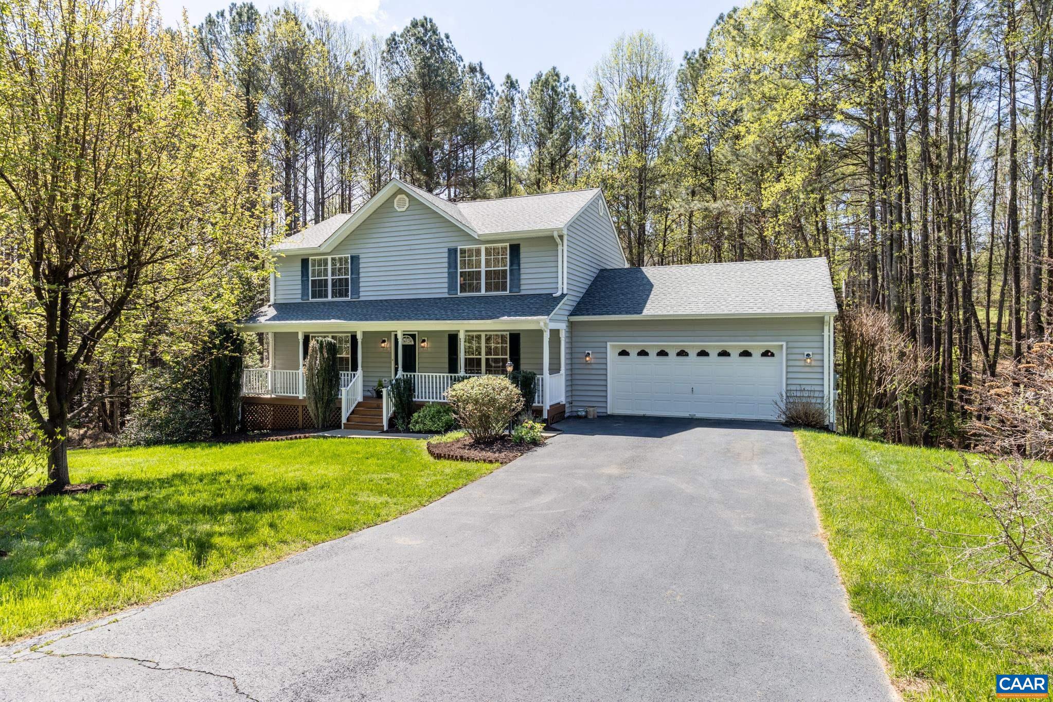 96 Red Cedar Road Barboursville, VA 22923 - Photo 49 of 59 a front view of a house with a yard and garage