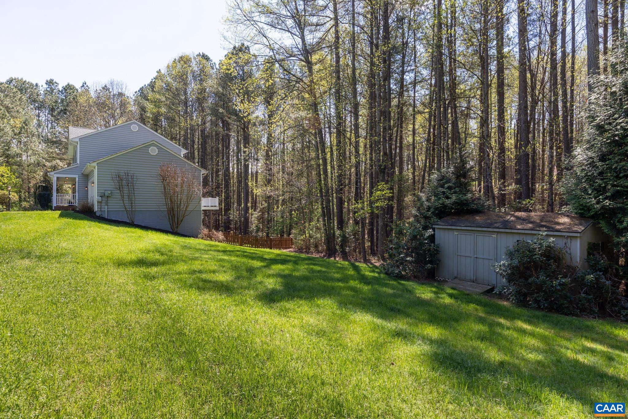 96 Red Cedar Road Barboursville, VA 22923 - Photo 52 of 59 a view of a backyard with potted plants and large trees