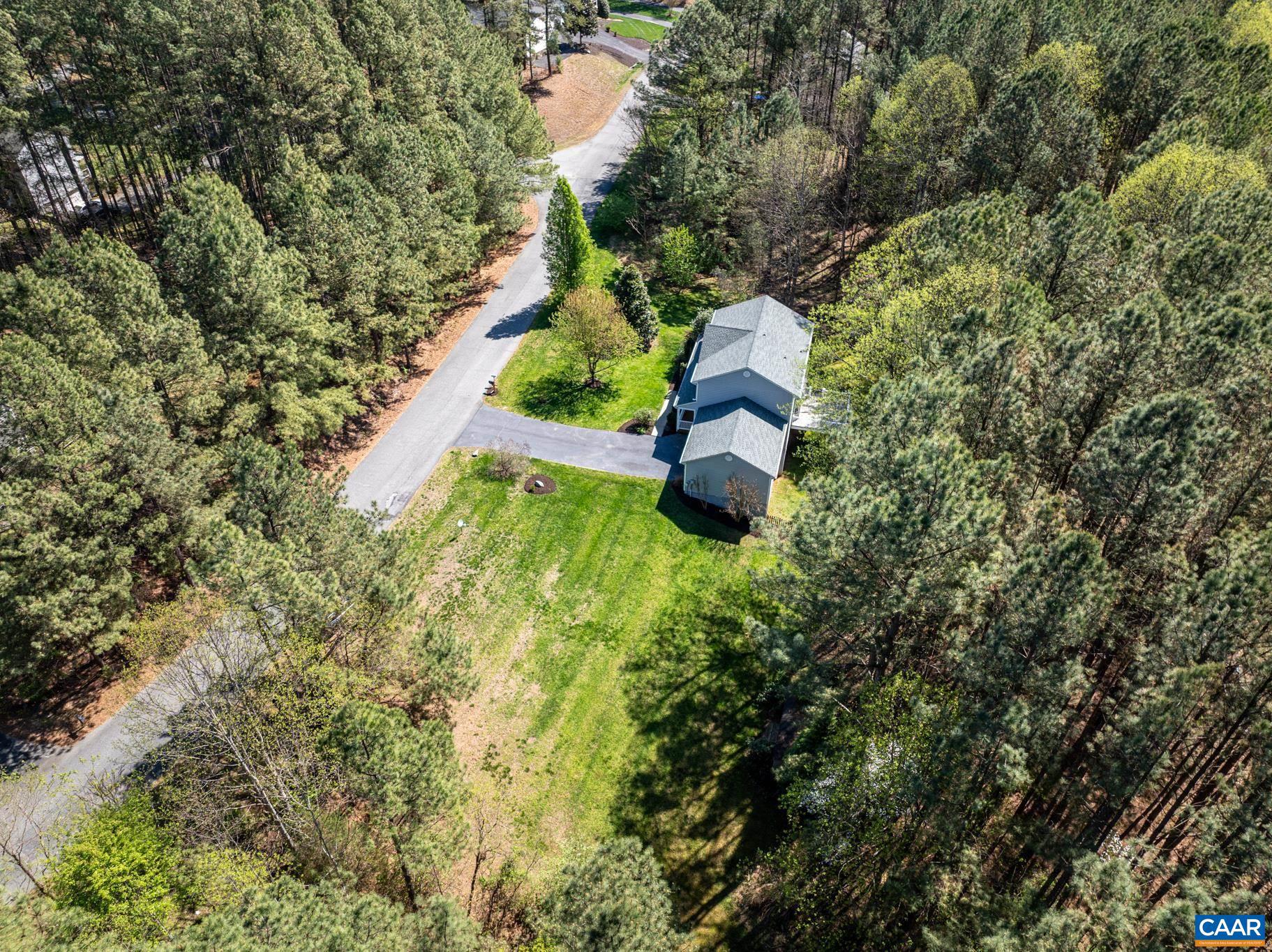 96 Red Cedar Road Barboursville, VA 22923 - Photo 53 of 59 an aerial view of a house with a yard and lake view