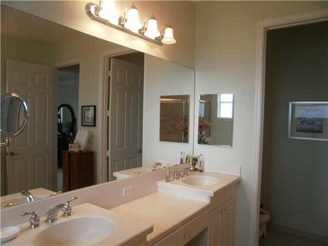 219 Southwest Walking Path Stuart, FL 34997 - Photo 13 of 24 a bathroom with a sink and a mirror