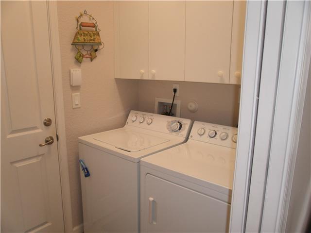 219 Southwest Walking Path Stuart, FL 34997 - Photo 18 of 24 a utility room with dryer and washer