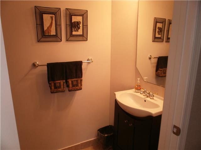 219 Southwest Walking Path Stuart, FL 34997 - Photo 9 of 24 a bathroom with a sink and mirror