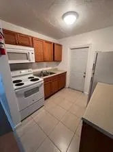 a kitchen with stainless steel appliances a stove and a refrigerator