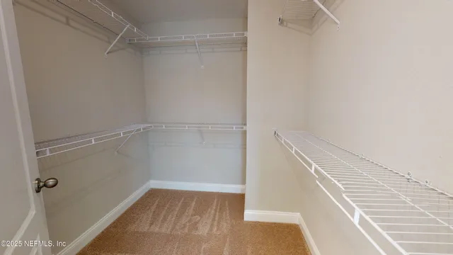 a bathroom with a bathtub sink and mirror