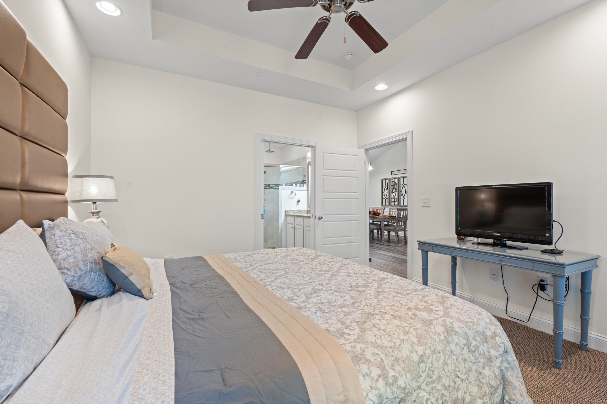 900 Jackline Place, Unit 202 Murrells Inlet, SC 29576 - Photo 27 of 39 Carpeted bedroom featuring recessed lighting, a raised ceiling, ensuite bathroom, and ceiling fan