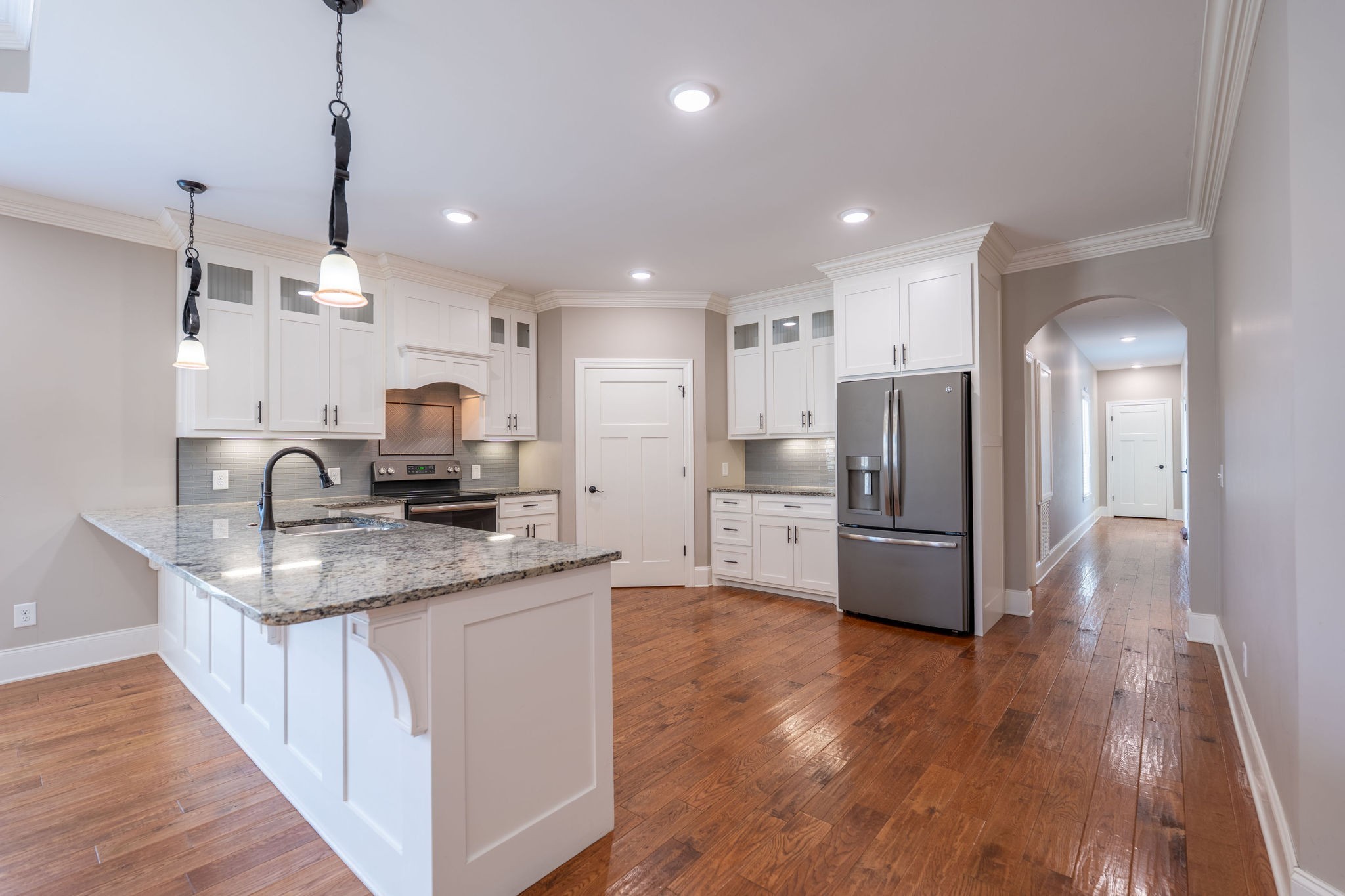 219 Waterloo Street Lawrenceburg, TN 38464 - Photo 11 of 39 a kitchen with stainless steel appliances a refrigerator sink and microwave