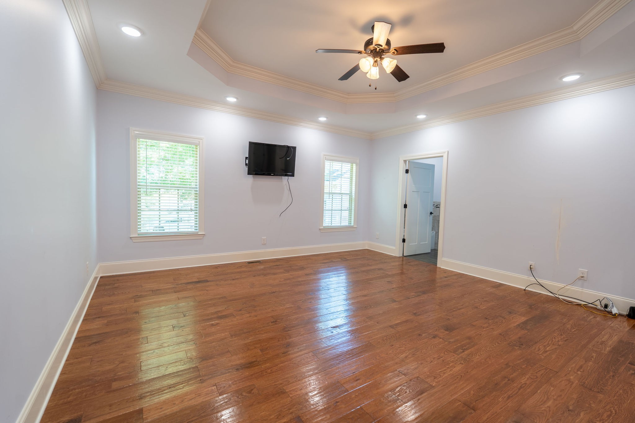 219 Waterloo Street Lawrenceburg, TN 38464 - Photo 13 of 39 a view of an empty room with a window and wooden floor