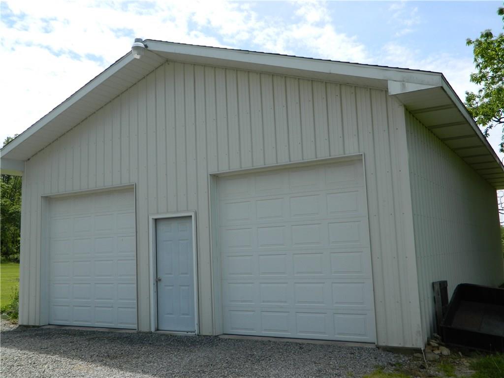 1050 Winfield Road Cabot, PA 16023 - Photo 19 of 23 BUT WAIT..THERE'S MORE! THIS GARAGE HAD 4 CARS AND A WORKBENCH AND STILL ROOM TO MOVE FREELY. IT'S LIKE A DREAM COME TRUE