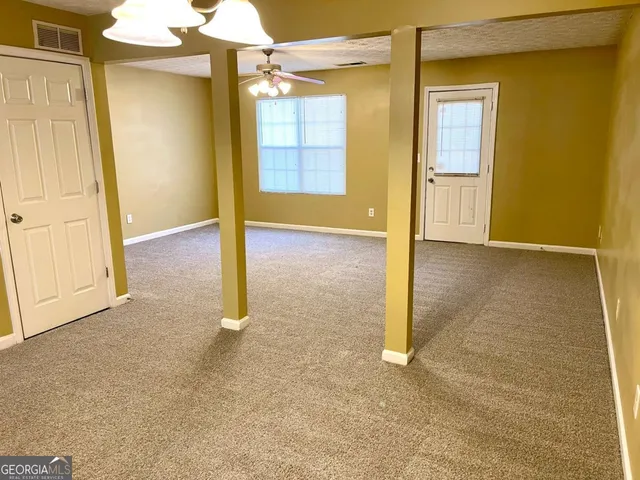 an empty room with a bathroom