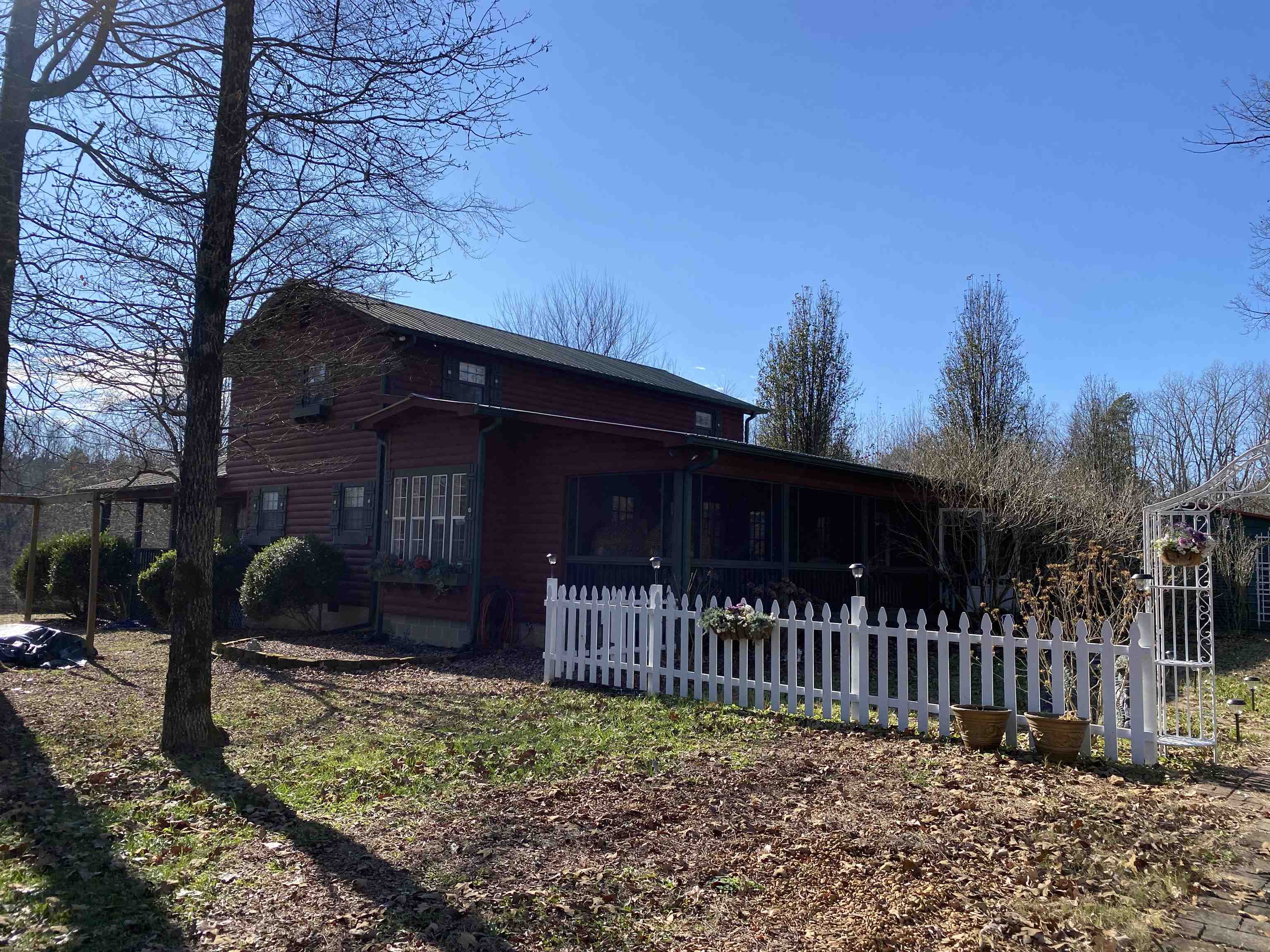 2835 Cerro Gordo Road Olivehill, TN 38475 - Photo 2 of 40 a view of a house with a small yard and wooden fence