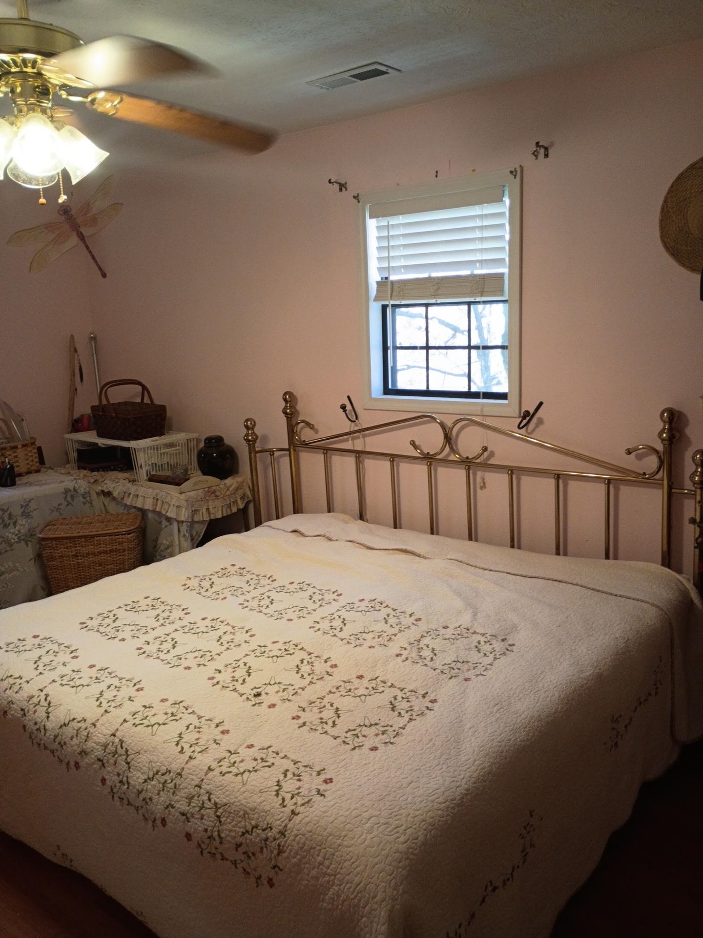 2835 Cerro Gordo Road Olivehill, TN 38475 - Photo 21 of 40 a bedroom with a bed and wooden floor