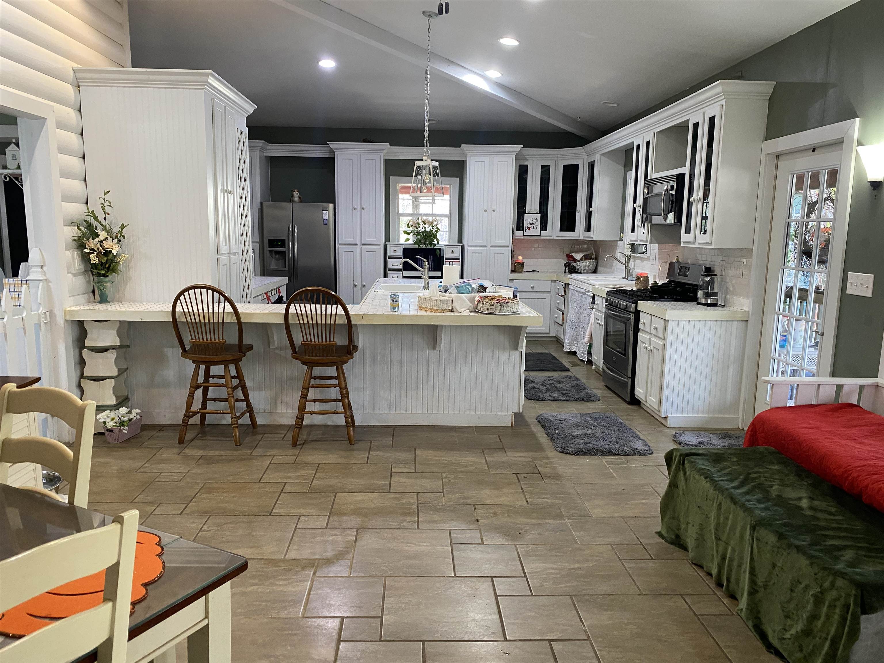 2835 Cerro Gordo Road Olivehill, TN 38475 - Photo 7 of 40 a kitchen with stainless steel appliances granite countertop a refrigerator and a stove top oven