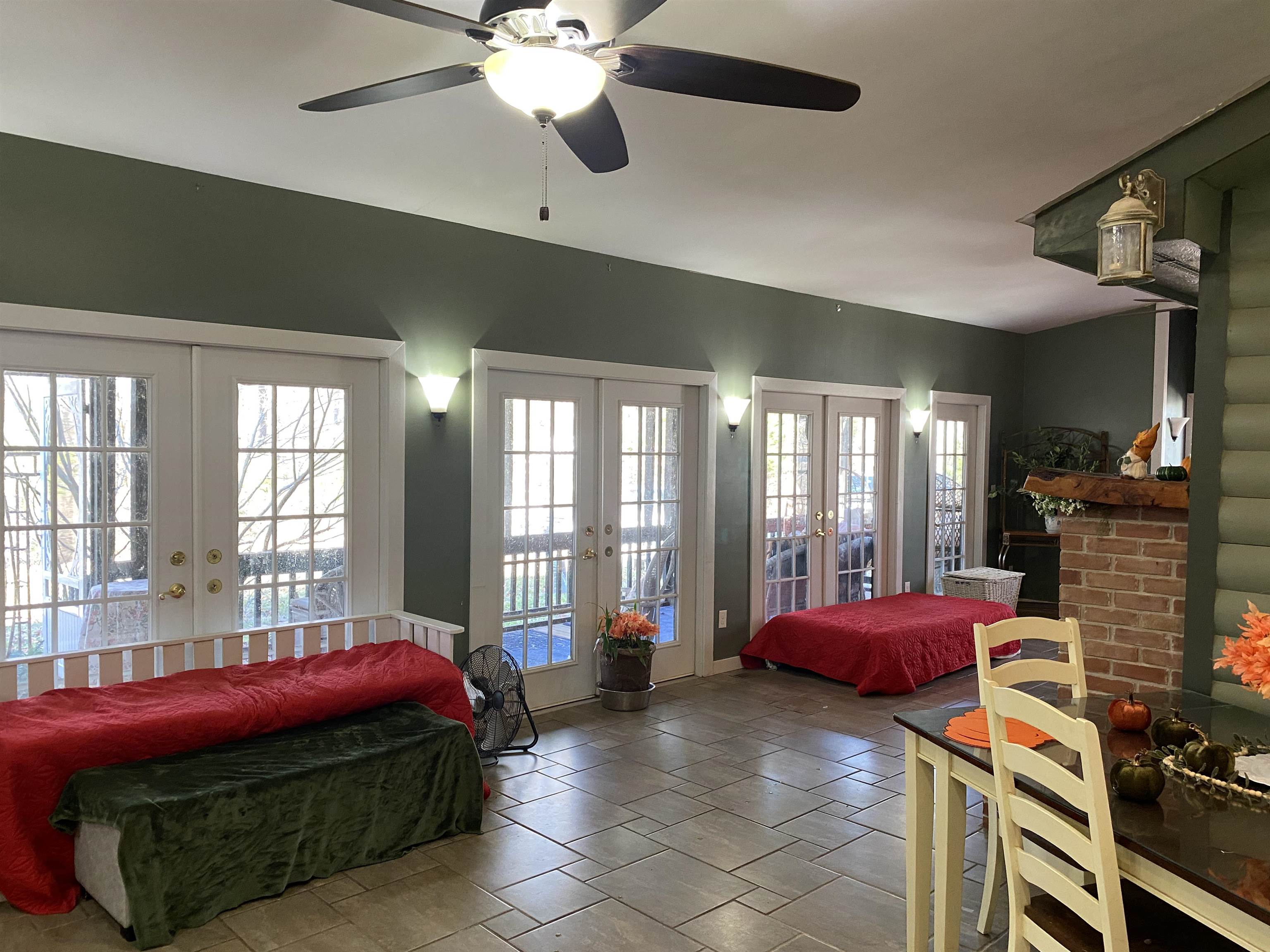 2835 Cerro Gordo Road Olivehill, TN 38475 - Photo 9 of 40 a spacious bedroom with a bed and glass windows