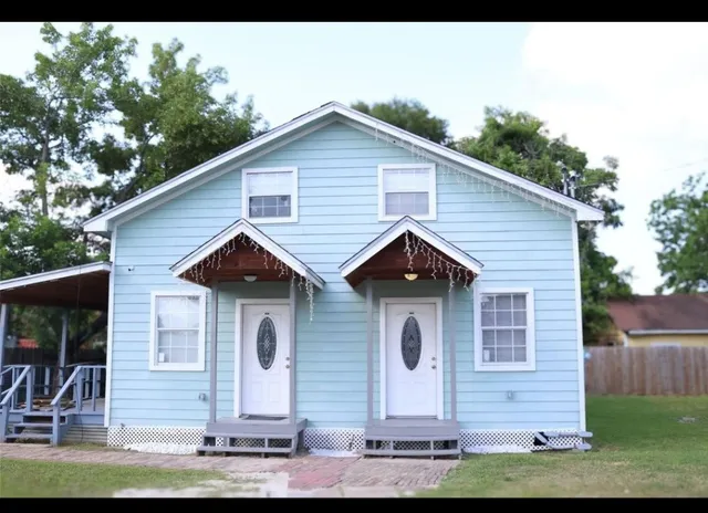 a front view of a house with garage