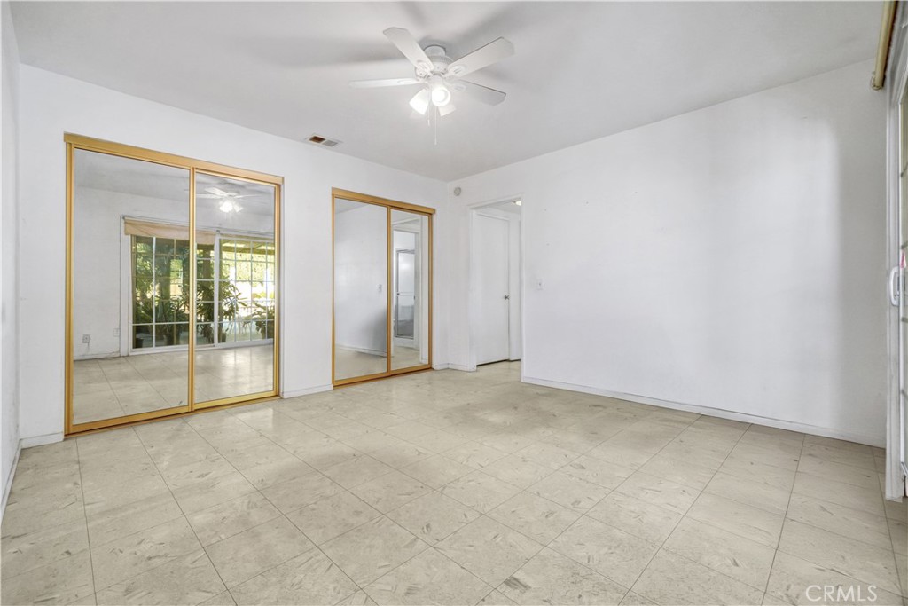 23141 Tulip Street Lake Forest, CA 92630 - Photo 14 of 27 an empty room with fan and windows