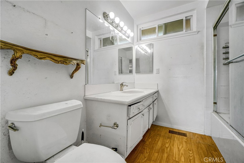 23141 Tulip Street Lake Forest, CA 92630 - Photo 22 of 27 a bathroom with a sink toilet and shower