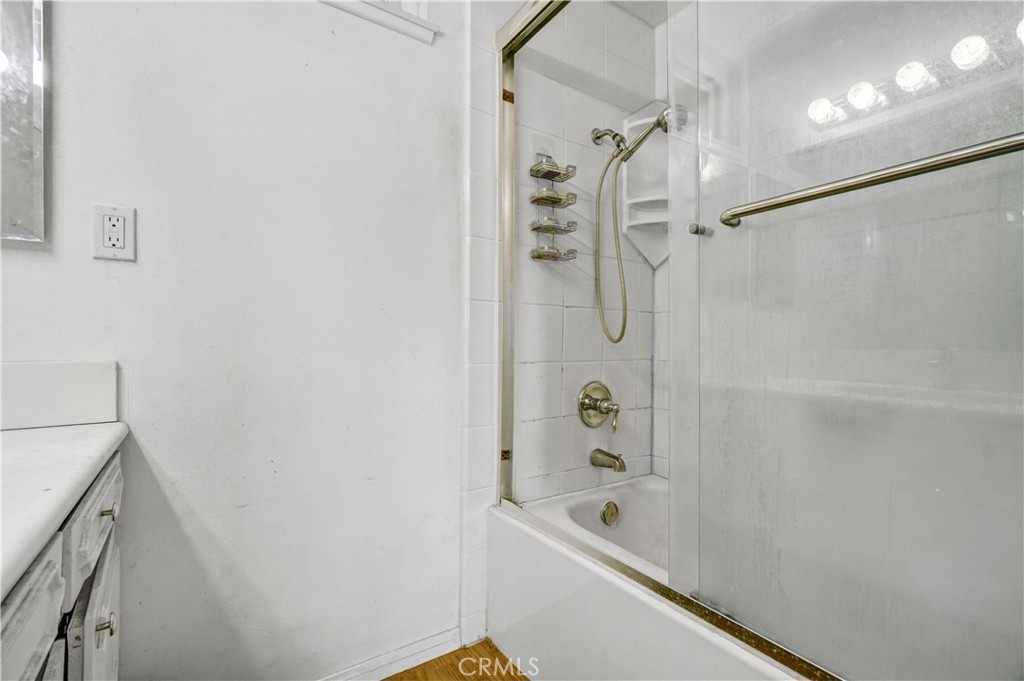 23141 Tulip Street Lake Forest, CA 92630 - Photo 23 of 27 a bathroom with a bathtub and a shower