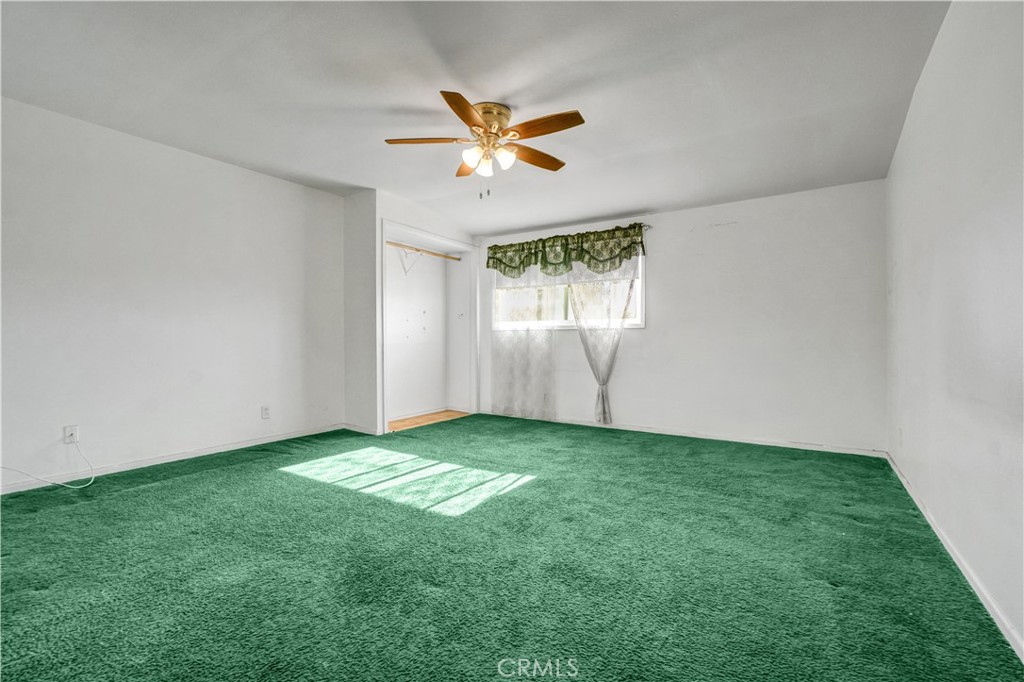 23141 Tulip Street Lake Forest, CA 92630 - Photo 24 of 27 a view of a livingroom with a ceiling fan and window