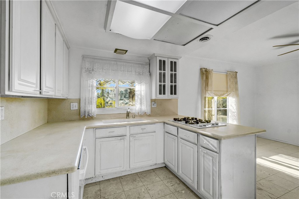 23141 Tulip Street Lake Forest, CA 92630 - Photo 4 of 27 a kitchen with stainless steel appliances granite countertop a sink stove and cabinets