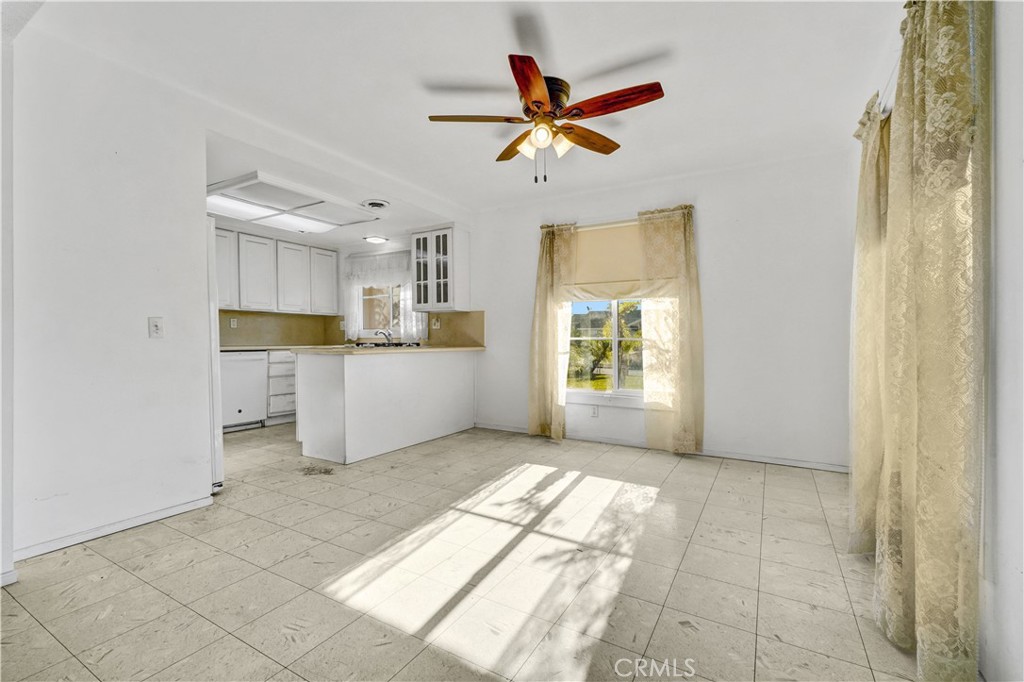 23141 Tulip Street Lake Forest, CA 92630 - Photo 8 of 27 a view of a kitchen with wooden cabinet and a window