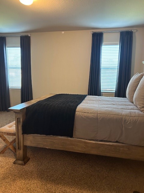 7723 London Tower Lane Houston, TX 77044 - Photo 8 of 11 a bedroom with a bed and window