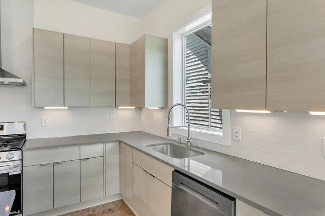 a kitchen with a sink and cabinets