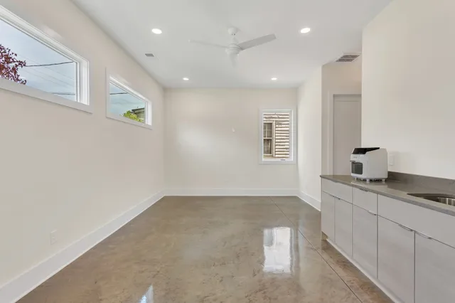 a view of a kitchen with a sink and a window