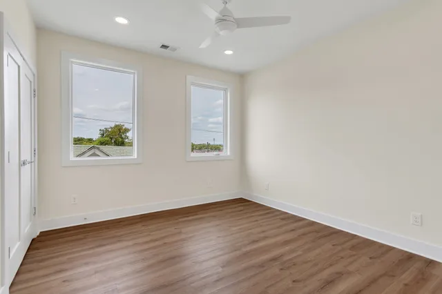 wooden floor in an empty room with window