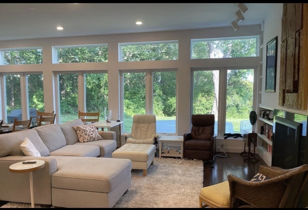 25 Sturges Road, Unit 2 Sharon, MA 02067 - Photo 13 of 28 a living room with furniture and a large window