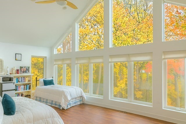 25 Sturges Road, Unit 2 Sharon, MA 02067 - Photo 22 of 28 a bed sitting in a bedroom next to a window