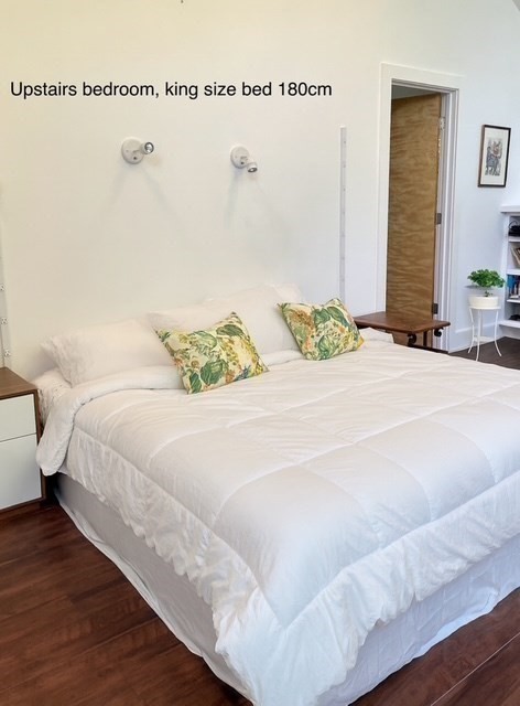 25 Sturges Road, Unit 2 Sharon, MA 02067 - Photo 23 of 28 a bedroom with a bed and a potted plant
