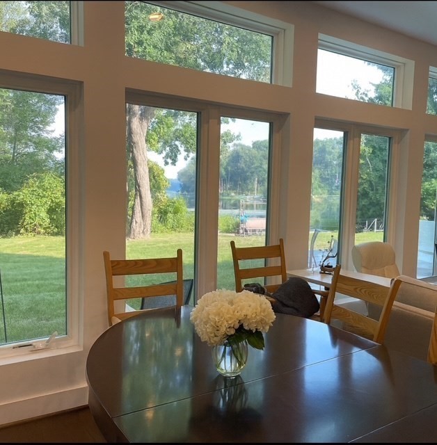 25 Sturges Road, Unit 2 Sharon, MA 02067 - Photo 7 of 28 a living room with large glass windows and a table