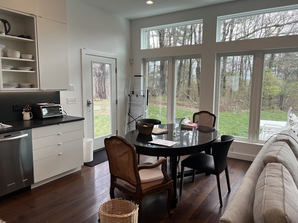 25 Sturges Road, Unit 2 Sharon, MA 02067 - Photo 8 of 28 a view of a dining room with furniture window and outside view