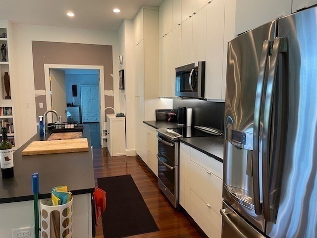 25 Sturges Road, Unit 2 Sharon, MA 02067 - Photo 10 of 28 a kitchen with stainless steel appliances a refrigerator sink and stove