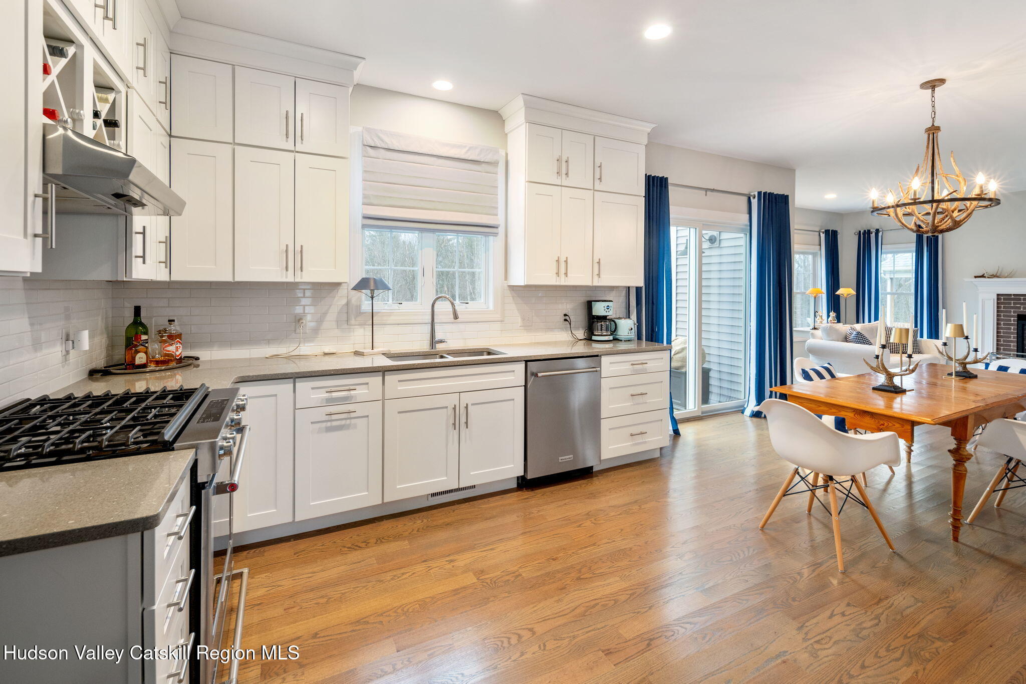 22 Edinburgh Court New Scotland, NY 12159 - Photo 14 of 48 a kitchen with a sink a cabinets and chairs