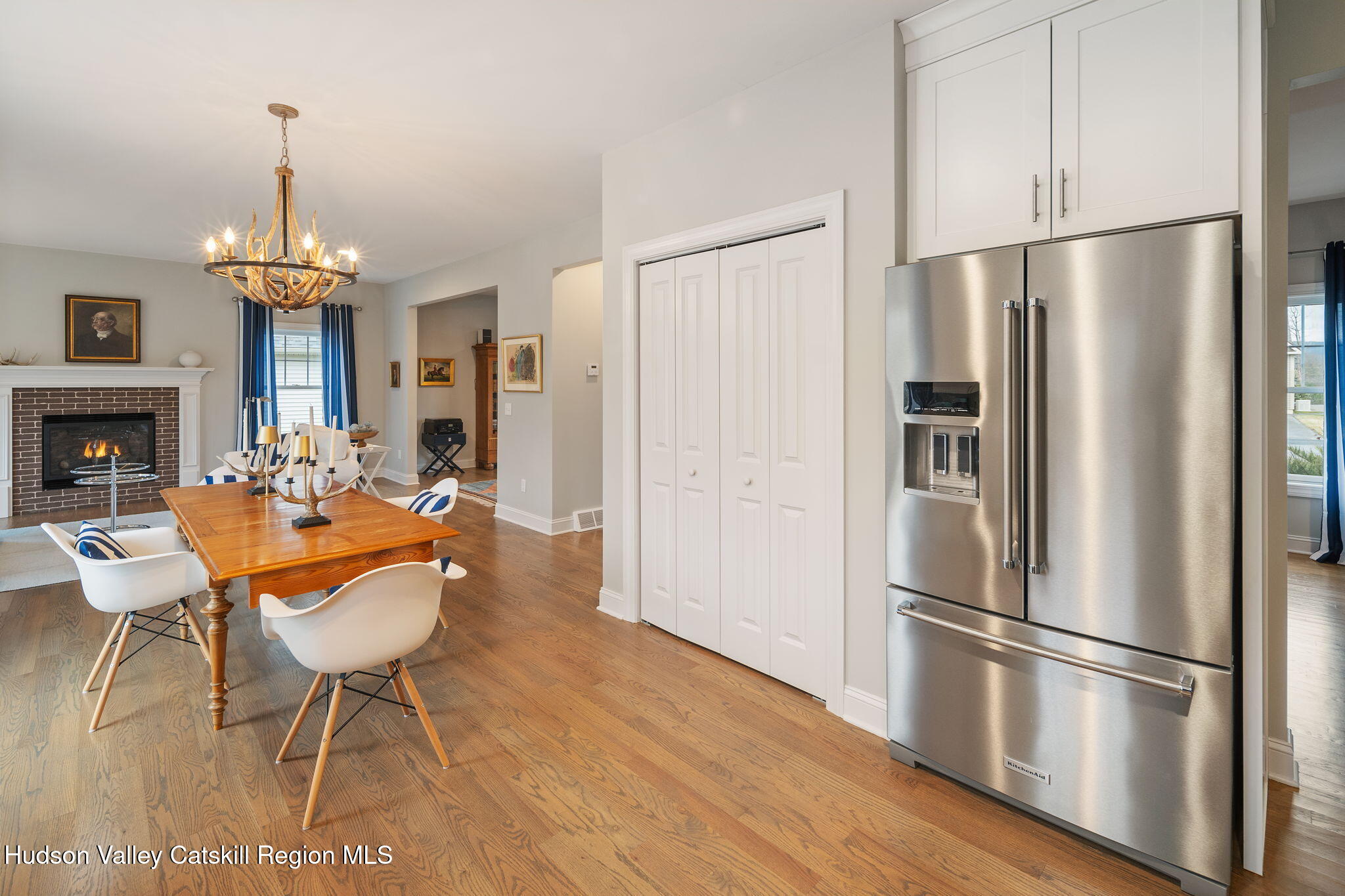 22 Edinburgh Court New Scotland, NY 12159 - Photo 15 of 48 a kitchen with stainless steel appliances a refrigerator a stove a kitchen island with a dining table and wooden floor