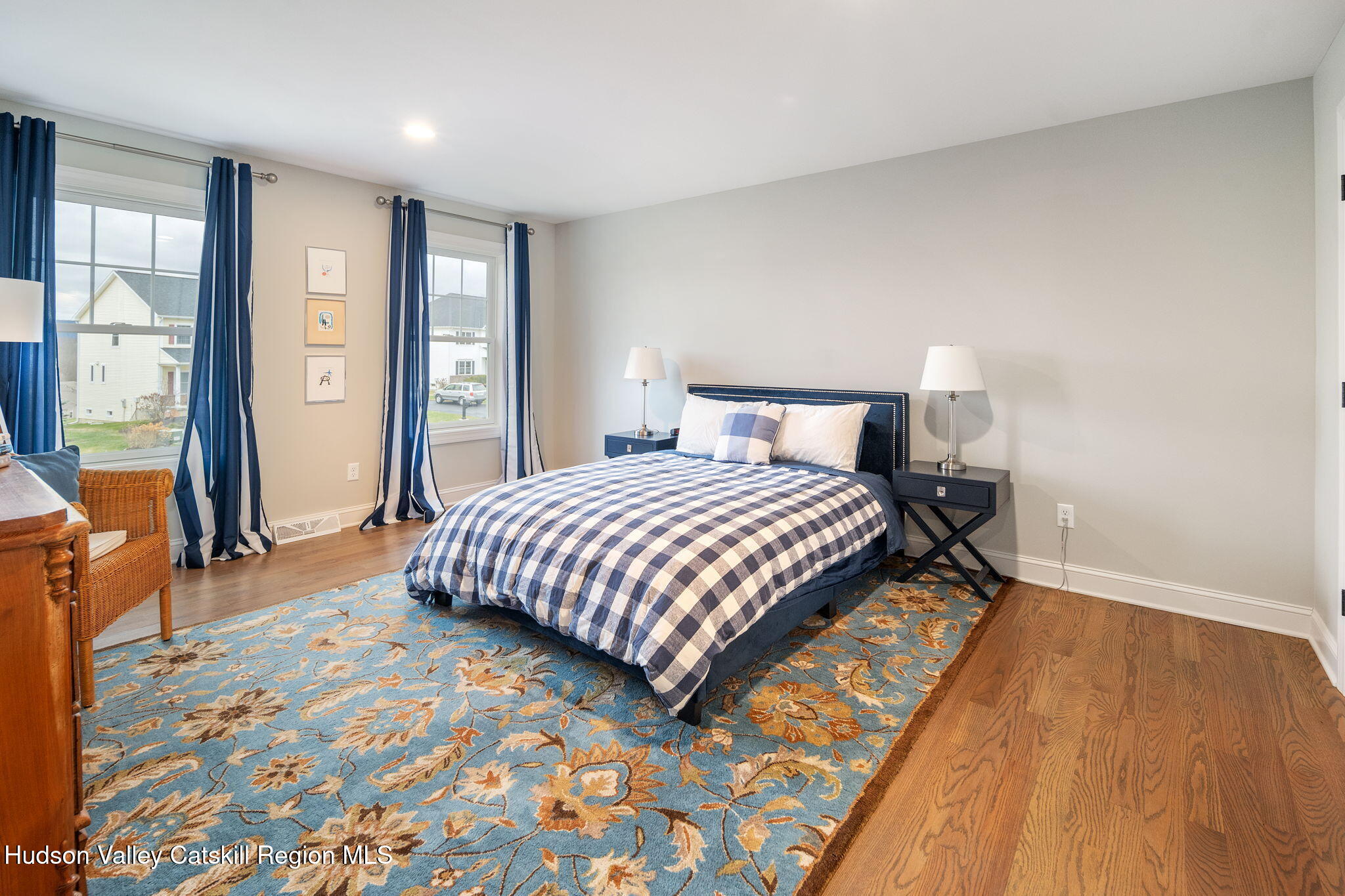 22 Edinburgh Court New Scotland, NY 12159 - Photo 2 of 48 a bedroom with a bed and wooden floor