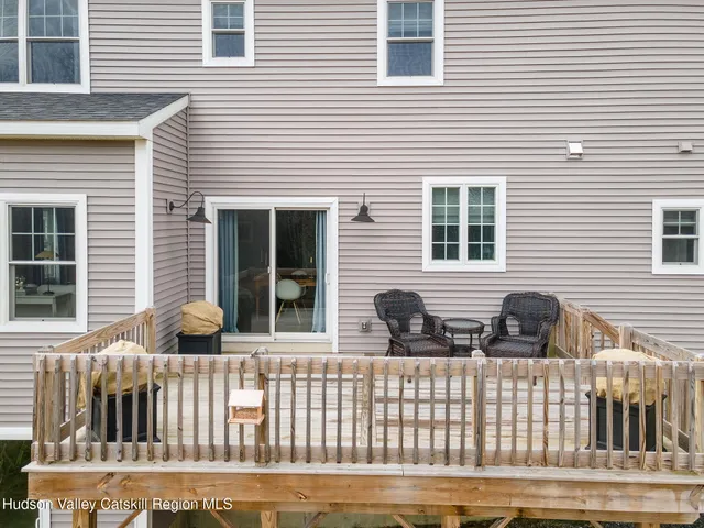 a view of a brick house with large windows